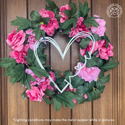 Door wreath with love is all around sign