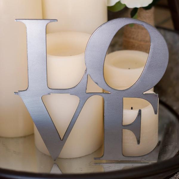 love sign next to candles