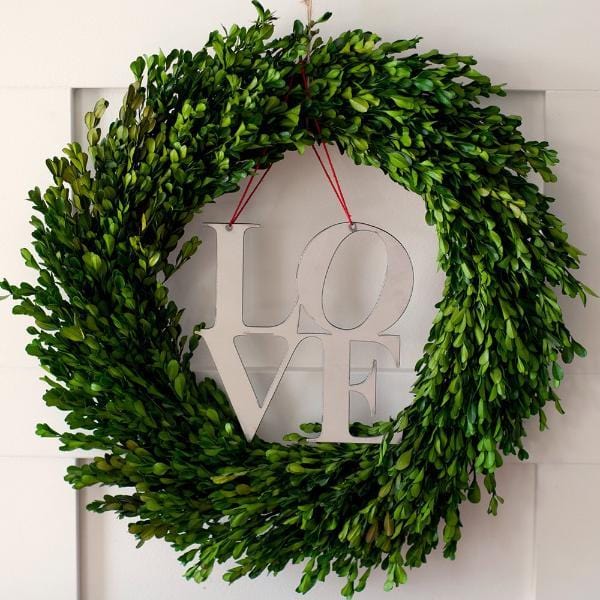 love sign on front door wreath