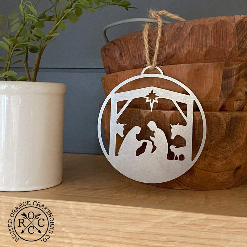 nativity ornament hanging on bowls