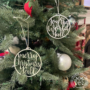 joy to the world yall and merry christmas yall ornaments on hanging on christmas tree