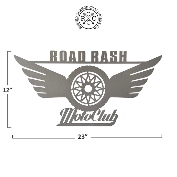 Metal motorcycle sign showing dimensions of 12 inches tall by 23 inches wide.