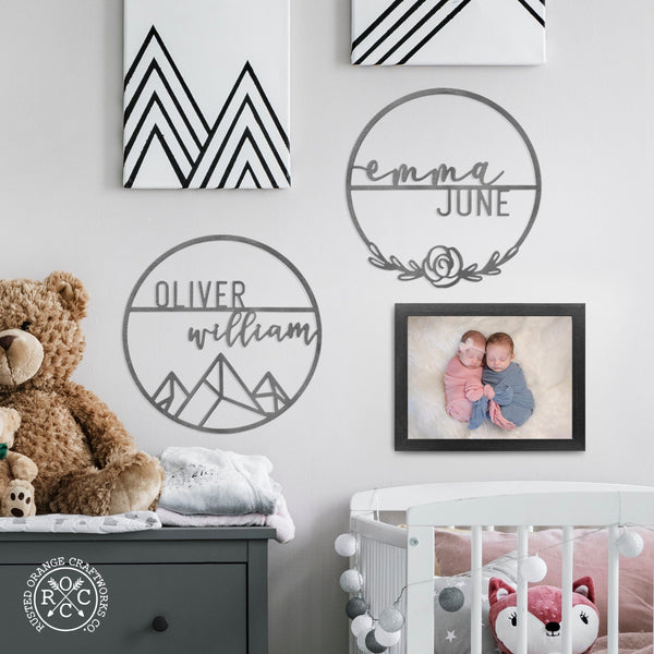 Mountain and rose sign on wall in nursery
