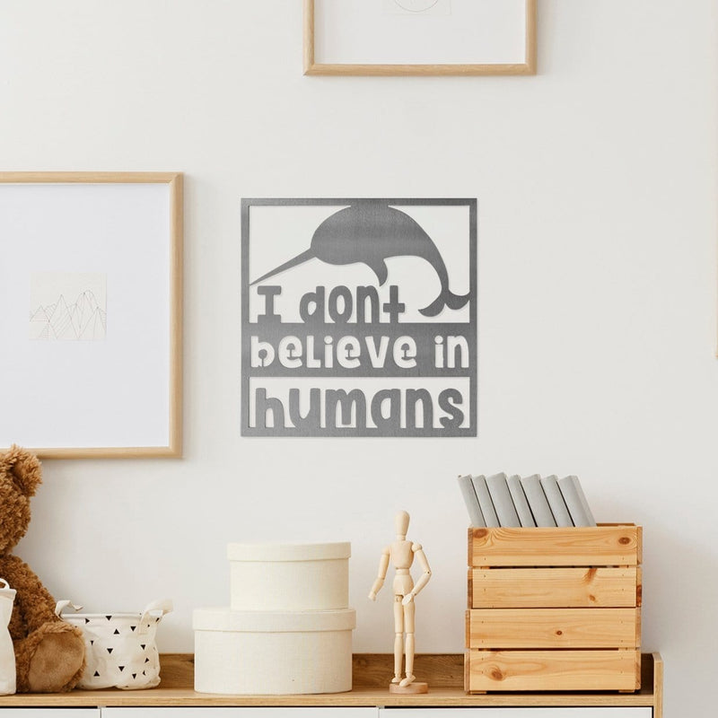Narwhal sign on wall above counter