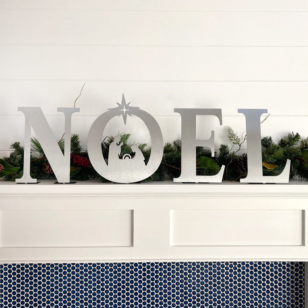 noel nativity set on mantle