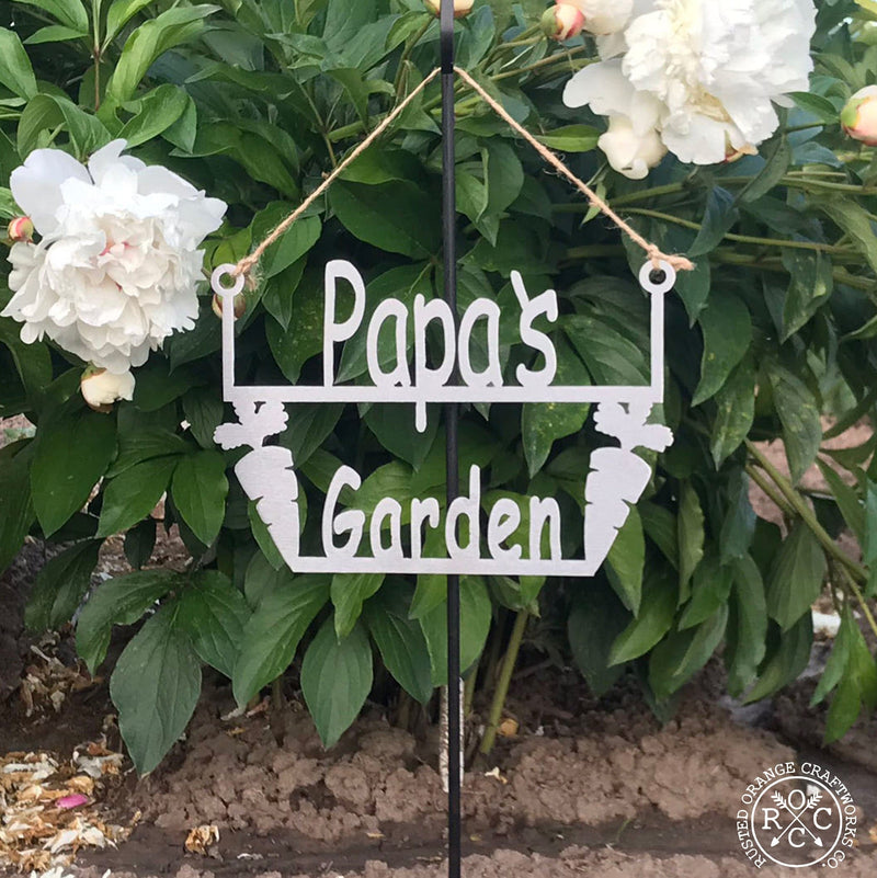 Papa's Garden Hanger in front of flowers