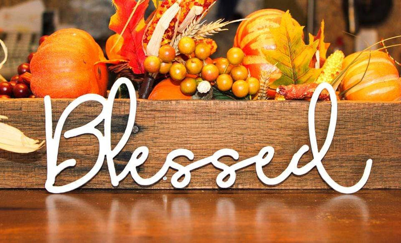 blessed sign leaning on fall decor