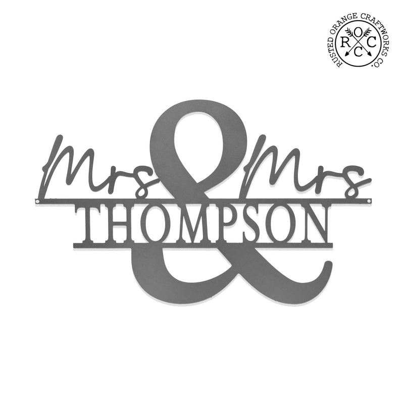 Metal personalized mr & mrs name sign shown against white background.