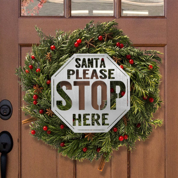 santa stop here sign on front door wreath