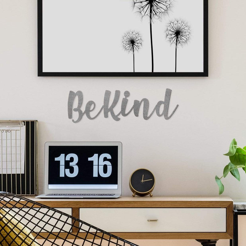 be kind sign on wall above desk