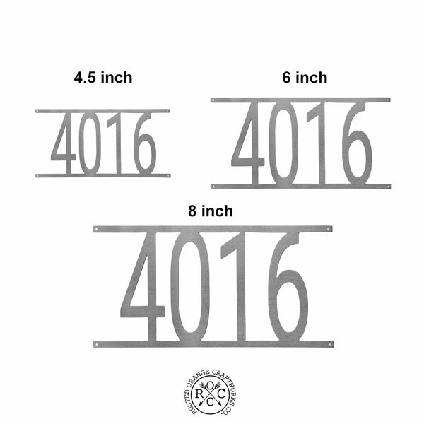3 custom metal address numbers comparing sizes.
