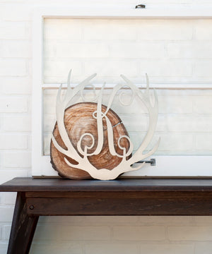 antler monogram on wood block