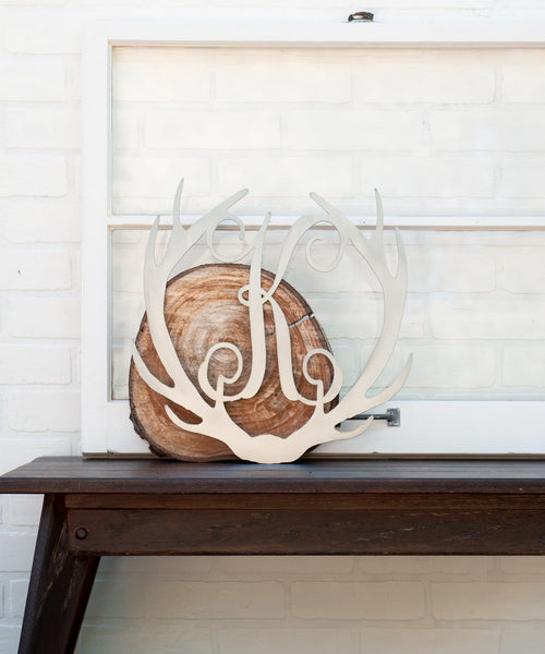 antler monogram on wood block