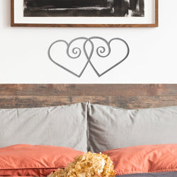 double swirl hearts above bed