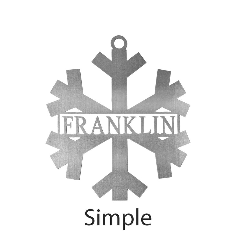Metal snowflake with last name in center shown against white background.