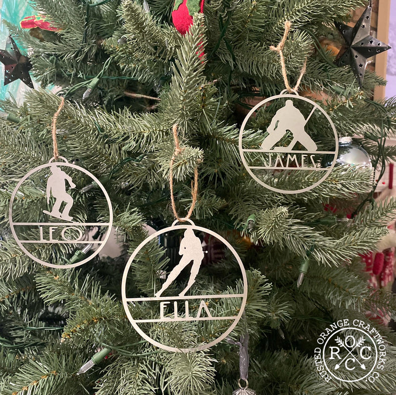 sports ornaments hanging on Christmas tree