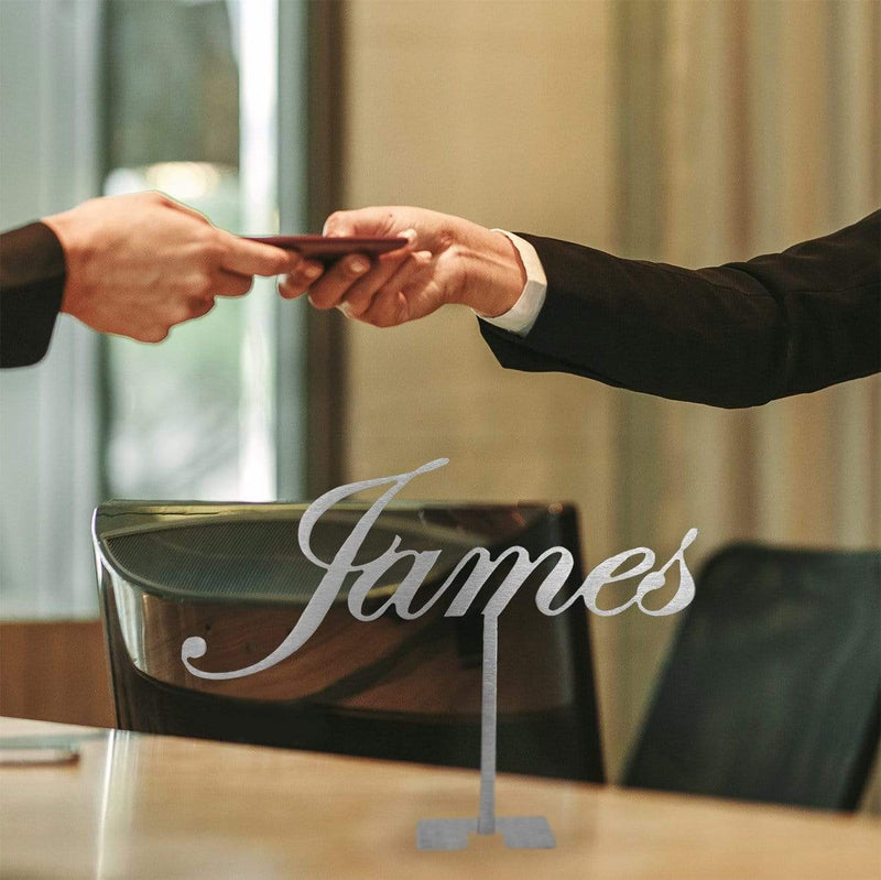 standing name sign on desk