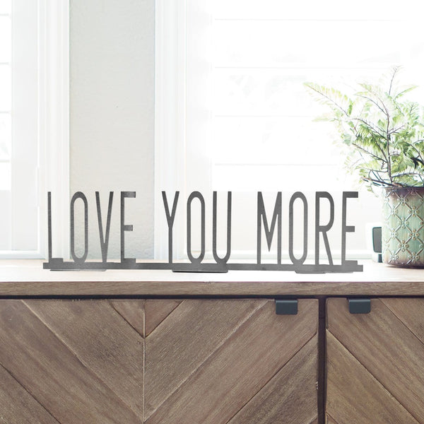 love you more sign on mantle