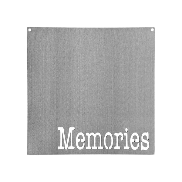 Square metal magnet board with the word memories etched at the bottom.