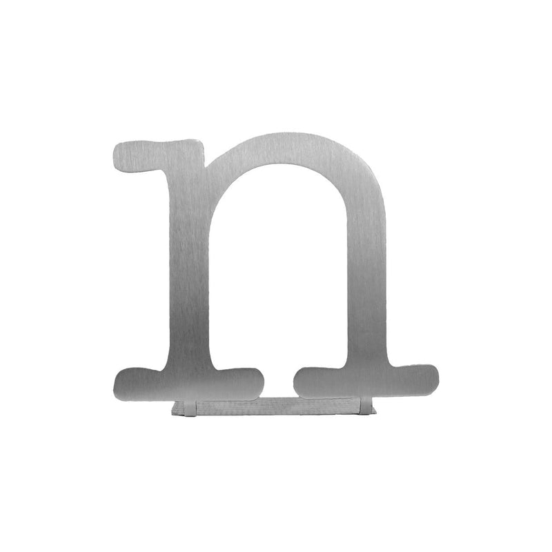 Metal letter N decoration with bendable tab for standing shown against white background.