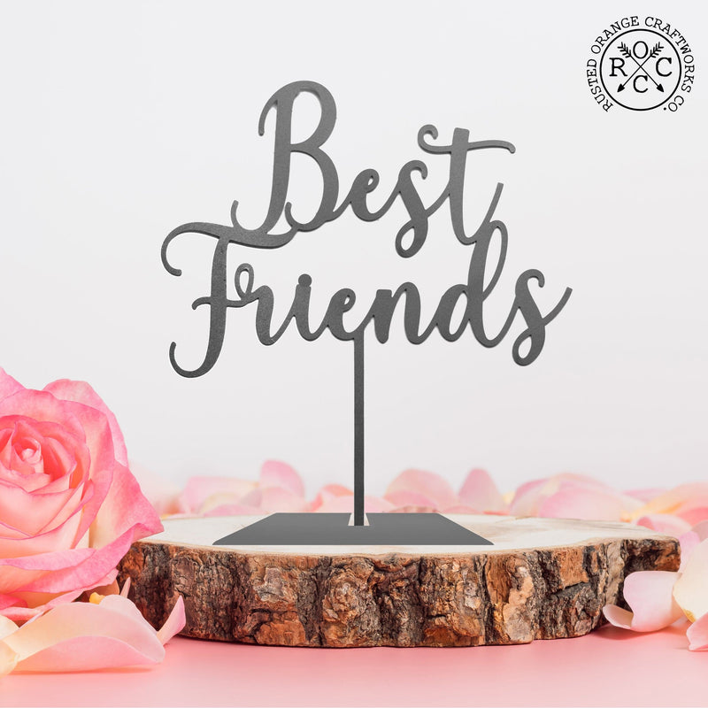 best friends sign on wooden platform surrounded by flowers
