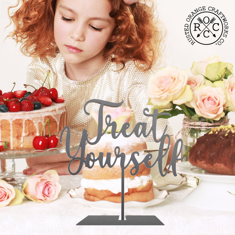 treat yourself sign on table by sweets at wedding