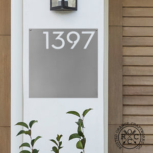 address plaque on wall