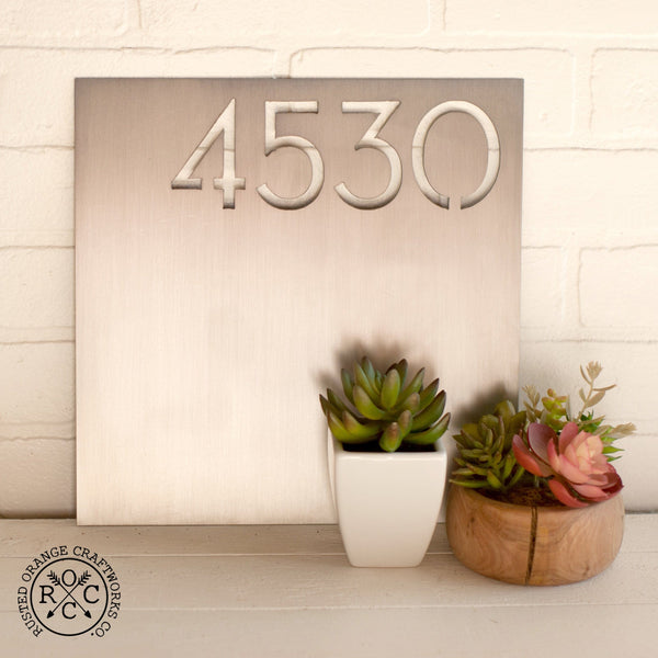 address plaque in kitchen on counter