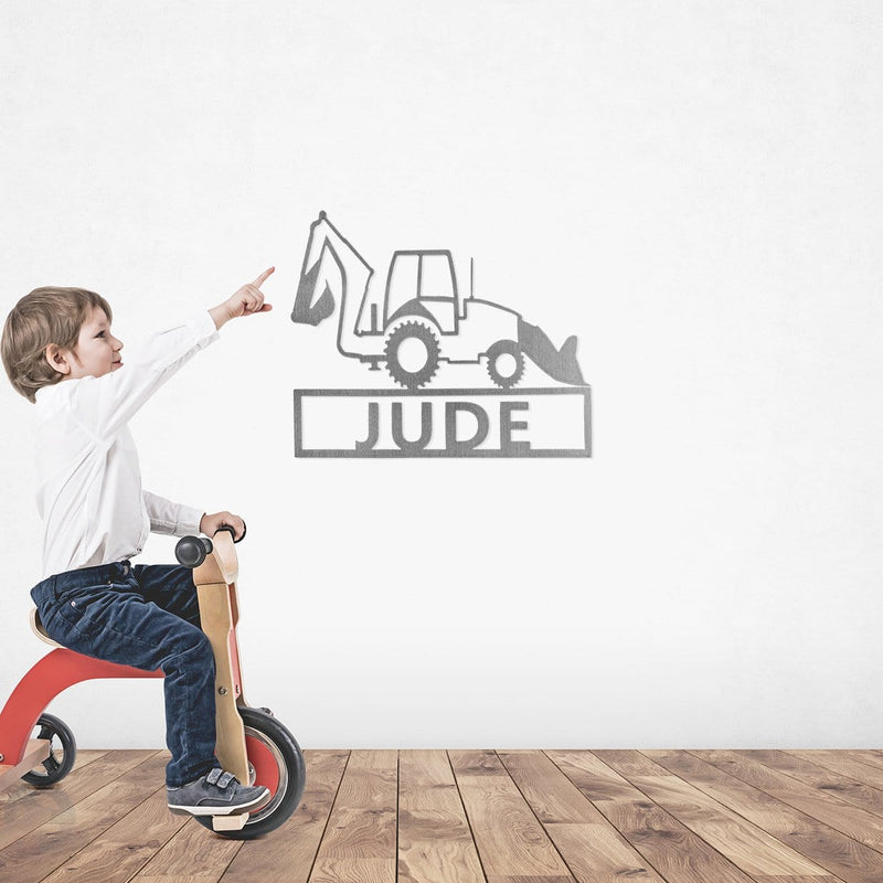work truck sign on wall with boy on toy bike