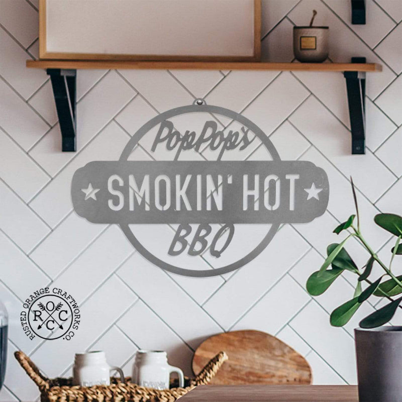 smoking hot bbq plaque on wall in kitchen