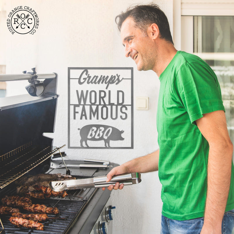 world famous bbq sign behind man at grill