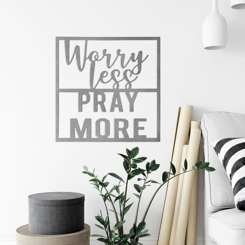 worry Less pray more sign on wall next to couch