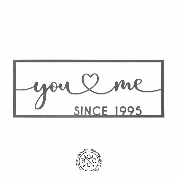 picture of metal sign with  customization you heart me since 1995 on blank background.  Rusted Orange Craftworks Co logo is at the bottom of the picture.  
